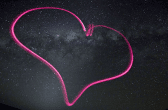 Image of the outline of a heart against space background
